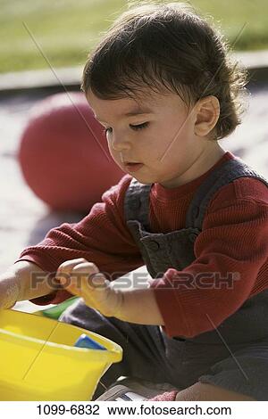 sand, people, playing, sitting, ball, playground, boy View Large Photo Image Stock Image - sand, people, playing, sitting, ball, playground, boy. Fotosearch