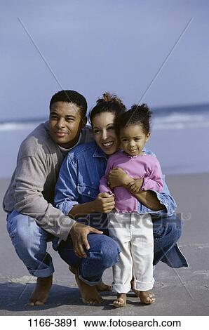 sand, people, water, beach, hugging, family, hug View Large Photo Image Stock Image - sand, people, water, beach, hugging, family, hug. Fotosearch