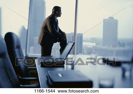 Picture - silhouette, business, laptops, contemplating, businessman. Fotosearch