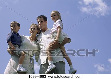 sky, people, outdoors, carrying, family, parents View Large Photo Image Stock Image - sky, people, outdoors, carrying, family, parents. Fotosearch