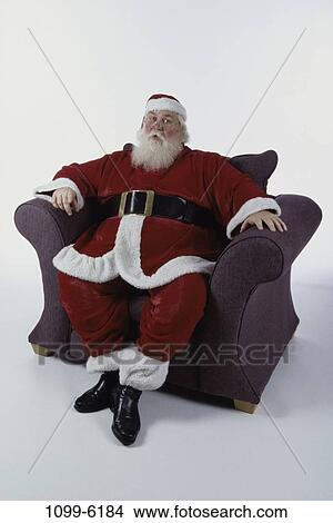 suit, chair, sitting, Christmas, beard, holiday View Large Photo Image Picture - suit, chair, sitting, Christmas, beard, holiday. Fotosearch