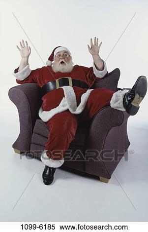 suit, chair, sitting, Christmas, gesturing, beard, surprised View Large Photo Image Stock Photography - suit, chair, sitting, Christmas, gesturing, beard, surprised. Fotosearch