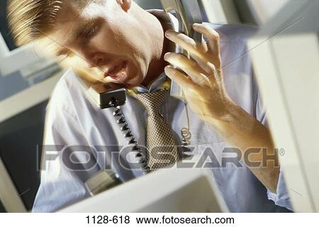 Stock Photo - talking, stress, business, chaotic, computers, multi-tasking. Fotosearch