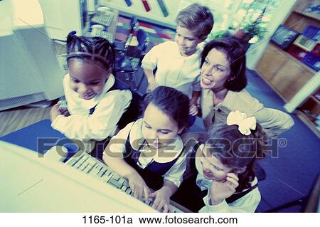 teacher, typing, classroom, studying, curious, teamwork, computers View Large Photo Image Stock Image - teacher, typing, classroom, studying, curious, teamwork, computers. Fotosearch