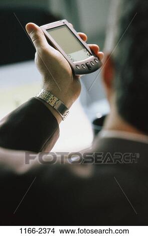 technology, computer, holding, business, Middle-aged, using View Large Photo Image Picture - technology, computer, holding, business, Middle-aged, using. Fotosearch