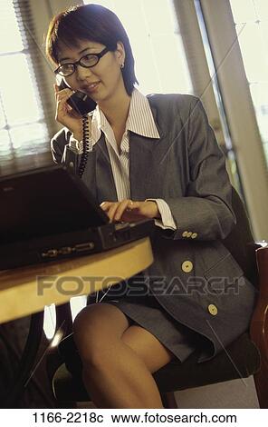 woman, telephone, Asian, listening, computer, laptop, phone View Large Photo Image Stock Image - woman, telephone, Asian, listening, computer, laptop, phone. Fotosearch