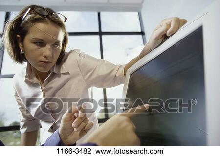 women, people, computer, pointing, business, point, looking View Large Photo Image Stock Image - women, people, computer, pointing, business, point, looking. Fotosearch