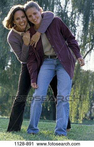 women, people, friendship, mother, outdoors, hugging, unity View Large Photo Image Stock Image - women, people, friendship, mother, outdoors, hugging, unity. Fotosearch