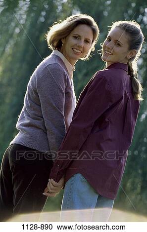 women, people, walking, friendship, mother, back, outdoors View Large Photo Image Stock Image - women, people, walking, friendship, mother, back, outdoors. Fotosearch