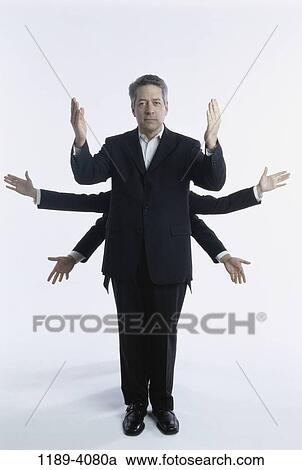 business, Middle-aged, multi-tasking, businessman, indoors View Large Photo Image Stock Image - business, Middle-aged, multi-tasking, businessman, indoors. Fotosearch