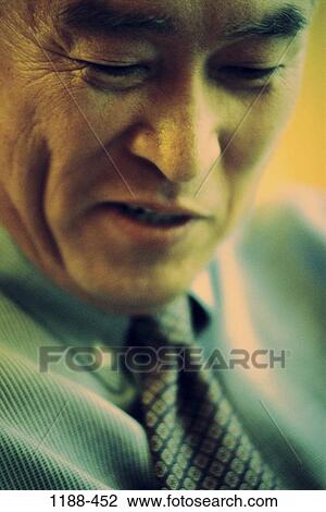 Stock Image - businessman, individual, amused, Middle-aged, business, Asian. Fotosearch