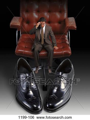 Stock Photograph - chair, shoes, anxious, fear, business, concepts, challenges. Fotosearch