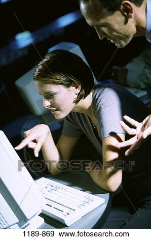 Stock Photo - computer, pointing, business, point, training, casual, office. Fotosearch
