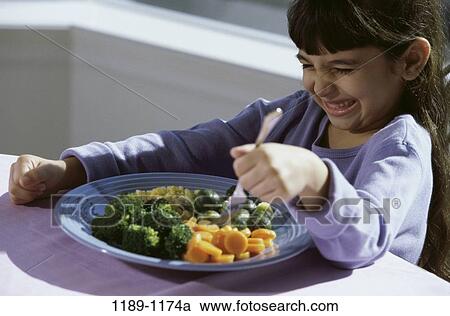 corn, people, eating, fork, plate, broccoli View Large Photo Image Stock Image - corn, people, eating, fork, plate, broccoli. Fotosearch
