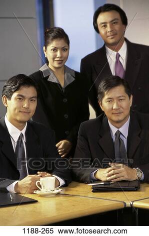 Stock Photography - coworkers, Asian, business, executives, portrait, indoors. Fotosearch