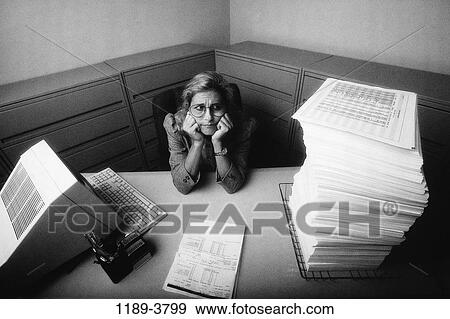 desk, woman, eyeglasses, isolation, computer, overwhelmed View Large Photo Image Stock Photo - desk, woman, eyeglasses, isolation, computer, overwhelmed. Fotosearch