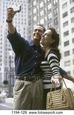 Stock Photo - exterior, buildings, couple, take, city, street, outdoors. Fotosearch