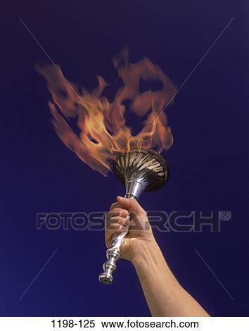 Stock Photography - fire, hand, arm, holding, motion, outdoors, awe. Fotosearch