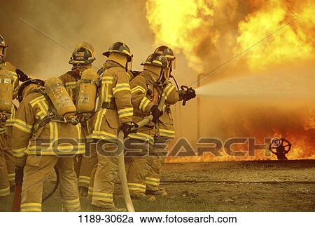 Stock Image - fire, water, challenges, strength, teamwork, unity, helmets. Fotosearch