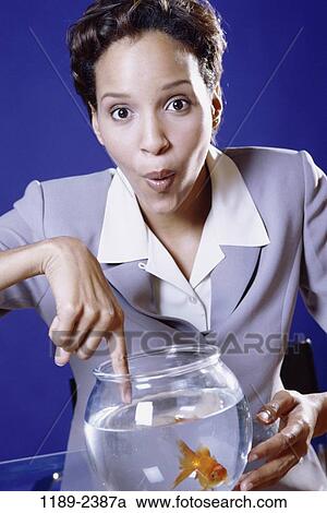 fish, woman, fishbowl, goldfish, pet, pointing, business View Large Photo Image Stock Image - fish, woman, fishbowl, goldfish, pet, pointing, business. Fotosearch