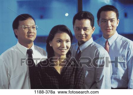 Stock Image - group, coworkers, Asian, Hispanic, standing, business. Fotosearch