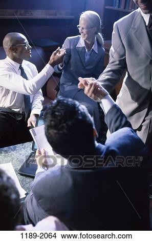 group, eyeglasses, teamwork, executives, meetings, unity, handshakes View Large Photo Image Picture - group, eyeglasses, teamwork, executives, meetings, unity, handshakes. Fotosearch