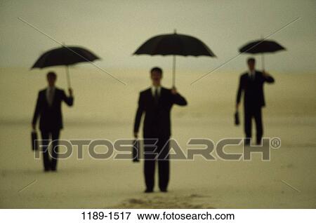 Stock Photo - group, men, business, outdoors, weather, umbrellas, businessmen. Fotosearch
