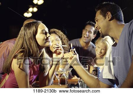 group, multiethnic, people, light, smiling, smoke, cigarette View Large Photo Image Stock Image - group, multiethnic, people, light, smiling, smoke, cigarette. Fotosearch