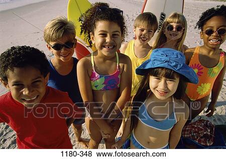 Stock Photo - group, multiethnic, people, smiling, hat, beach, sunglasses. Fotosearch