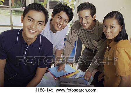 Stock Photography - group, multiethnic, smiling, table, coworkers, business. Fotosearch
