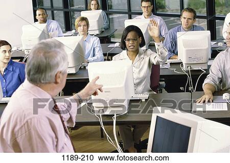 Stock Image - group, multiethnic, teacher, business, computers, class. Fotosearch
