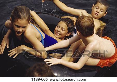 Stock Photography - group, people, swim, floating, pool, playing, swimming. Fotosearch