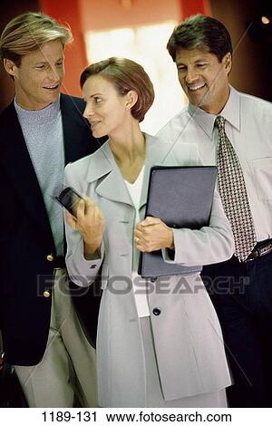 group, smiling, walking, talking, business, cell phone View Large Photo Image Stock Image - group, smiling, walking, talking, business, cell phone. Fotosearch