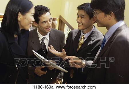 Stock Image - group, talking, Asian, conversation, business, teamwork. Fotosearch