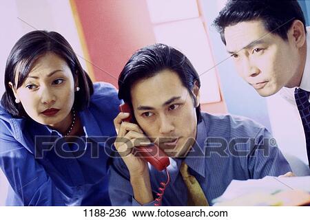 Stock Photograph - group, telephone, coworkers, Asian, phone, business. Fotosearch