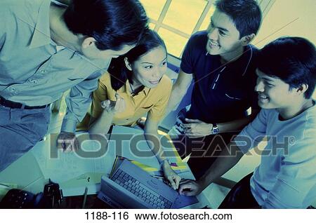 Stock Photograph - groups, smiling, Asian, gesturing, young, business, teamwork. Fotosearch