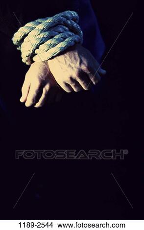 hands, rope, secure, trapped, tied, metaphor, crime View Large Photo Image Picture - hands, rope, secure, trapped, tied, metaphor, crime. Fotosearch