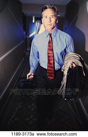 hotel, coat, briefcase, hallway, business, Middle-aged View Large Photo Image Stock Image - hotel, coat, briefcase, hallway, business, Middle-aged. Fotosearch