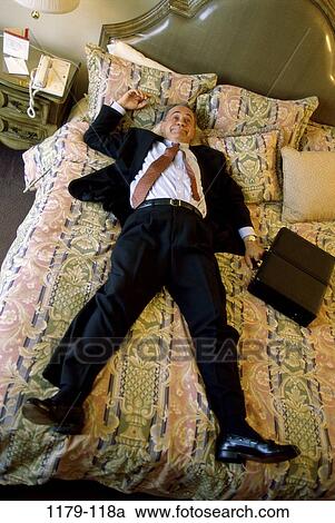 hotel, senior, bed, business, relaxing, resting View Large Photo Image Stock Image - hotel, senior, bed, business, relaxing, resting. Fotosearch