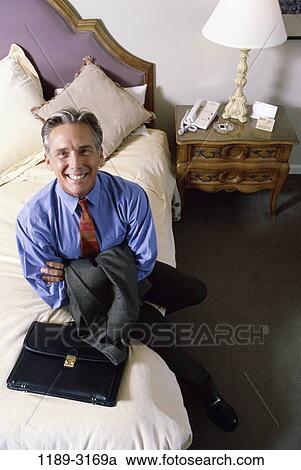 hotel, smiling, excited, bed, business, Middle-aged View Large Photo Image Stock Image - hotel, smiling, excited, bed, business, Middle-aged. Fotosearch