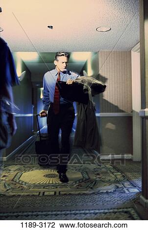 hotel, walking, hallway, business, Middle-aged, businessman View Large Photo Image Stock Image - hotel, walking, hallway, business, Middle-aged, businessman. Fotosearch