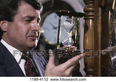 hourglass, business, timepieces, Middle-aged, shopping, picking View Large Photo Image Stock Image - hourglass, business, timepieces, Middle-aged, shopping, picking. Fotosearch