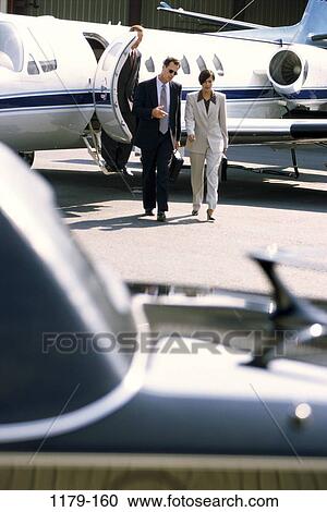 Stock Image - limousine, business, outdoors, transportation, cars, aircraft, airports. Fotosearch