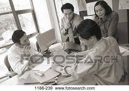 Stock Photo - meeting, group, Asian, teamwork, executives, planning, brainstorming. Fotosearch