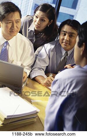 meeting, group, coworkers, talking, discussion, Asian, conversation View Large Photo Image Stock Image - meeting, group, coworkers, talking, discussion, Asian, conversation. Fotosearch