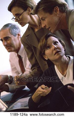 Stock Image - meeting, group, people, businessmen, Caucasian, businesswomen, Businesspeople conferring. Fotosearch