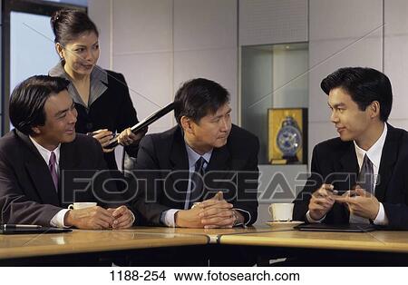 meeting, group, smiling, talking, Asian, conversation View Large Photo Image Picture - meeting, group, smiling, talking, Asian, conversation. Fotosearch