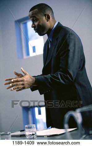 Stock Photo - meeting, indoors, aged, middle, executive, African-American. Fotosearch