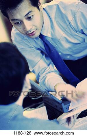 meeting, men, desk, Asian, laptop, aged, middle View Large Photo Image Stock Photograph - meeting, men, desk, Asian, laptop, aged, middle. Fotosearch