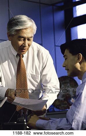 men, talking, paperwork, Asian, boss, business, questioning View Large Photo Image Stock Image - men, talking, paperwork, Asian, boss, business, questioning. Fotosearch